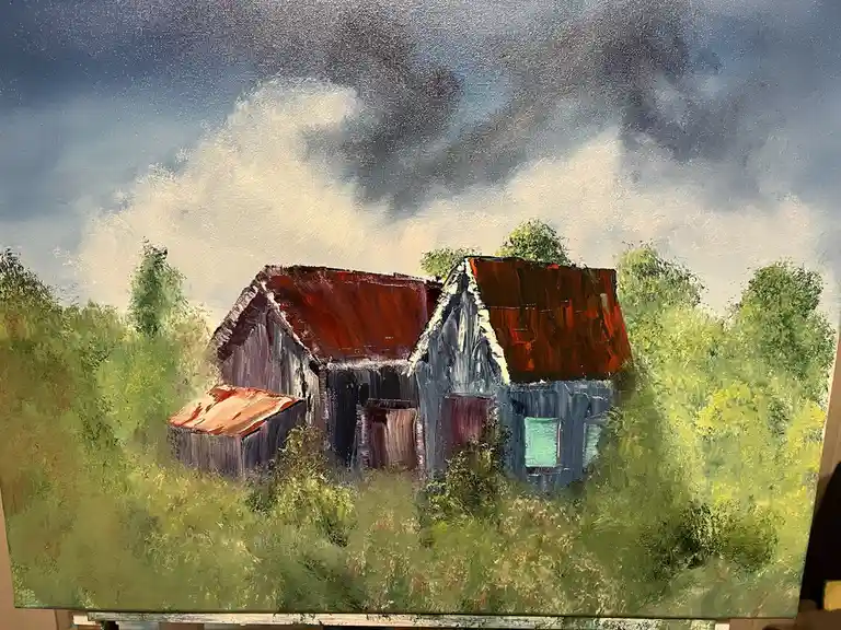 An oil painting depicts a rustic, weathered barn with a rusty red roof, surrounded by lush green foliage under a dramatic…