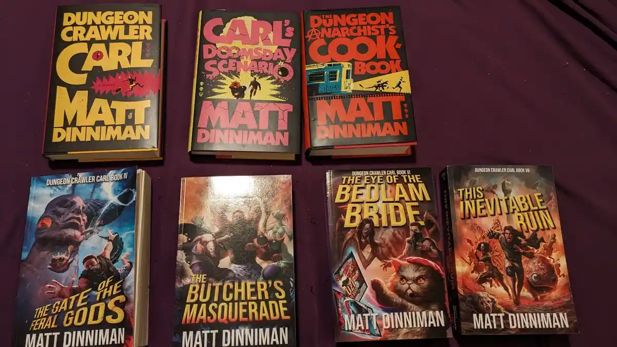Six books by Matt Dinniman titled 'Dungeon Crawler Carl' are displayed on a purple surface, featuring absurd and chaotic…