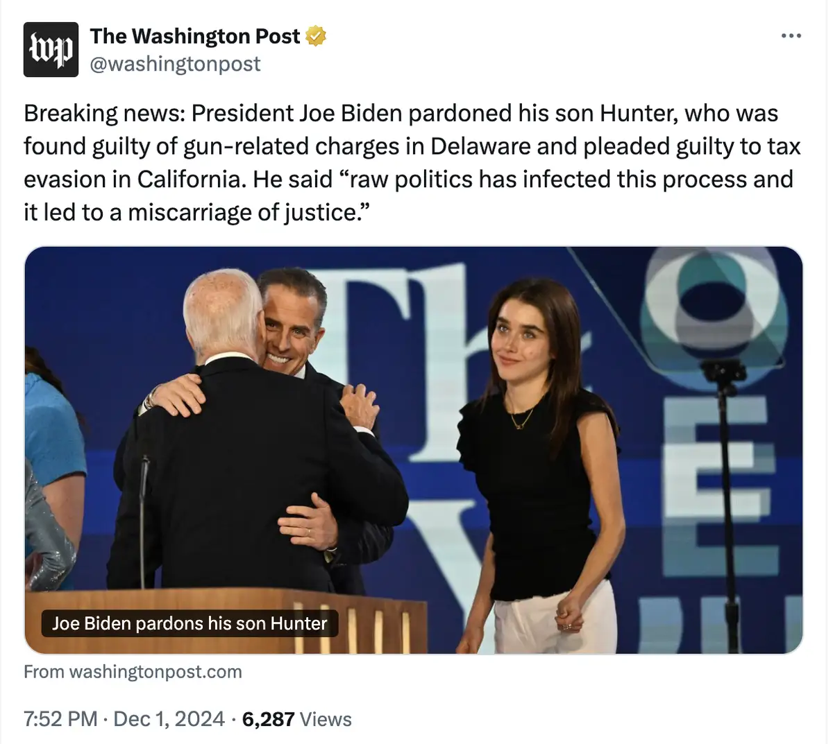 A screenshot of a Washington Post tweet shows a photo of President Joe Biden hugging a man while a woman stands nearby. The…