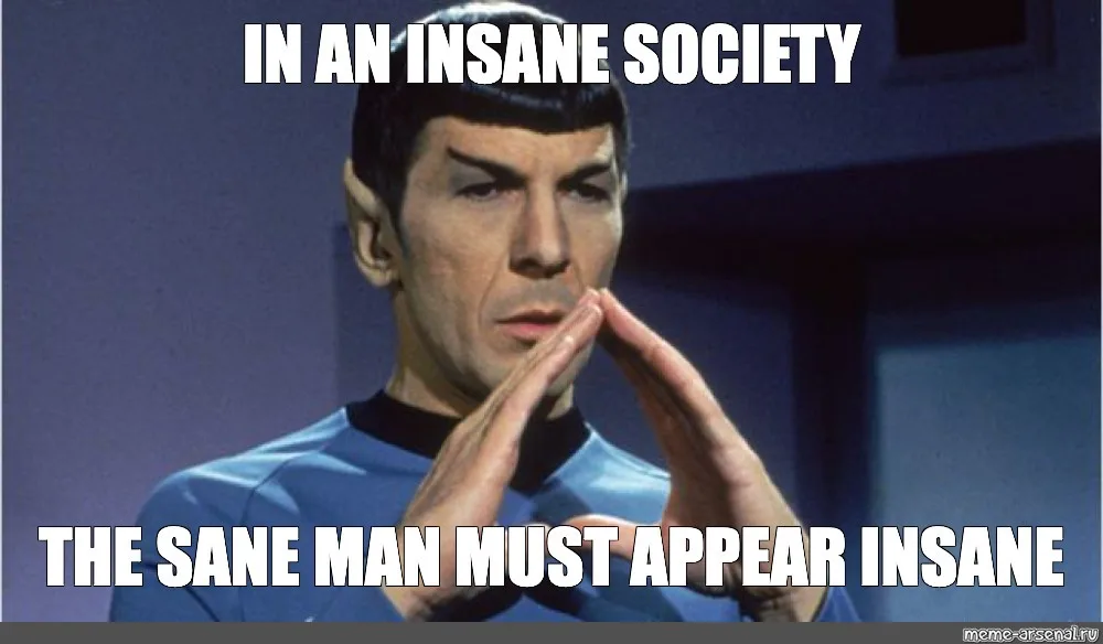 A still image of Spock from Star Trek, wearing his blue uniform and making his signature Vulcan salute with both hands…