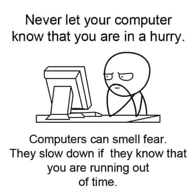 A simple black-and-white cartoon depicts a person with a frustrated expression sitting at a desk in front of an old-style…