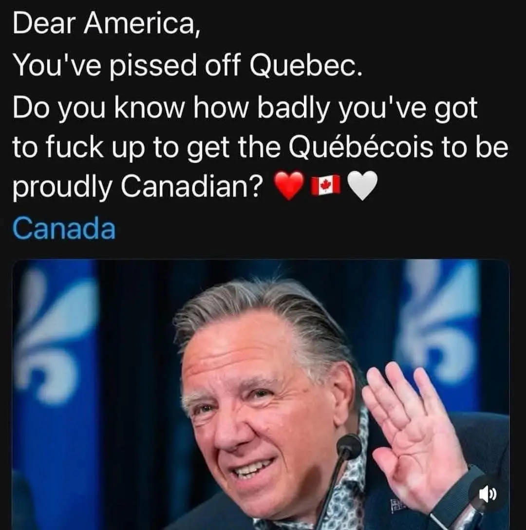 A photo of a smiling man waving at a microphone, with blue Quebec flags in the background. Overlaid white text reads: 'Dear…