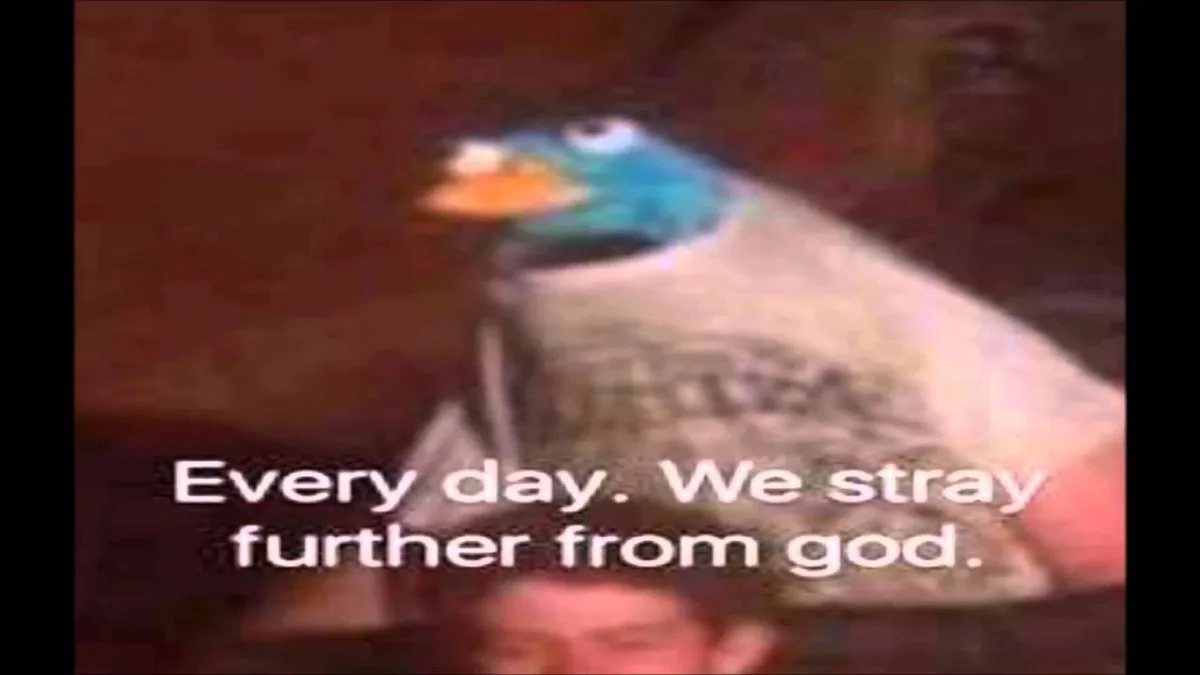 A blurry, low-resolution image of a blue-feathered bird puppet with an orange beak, likely from a children's show, is shown…