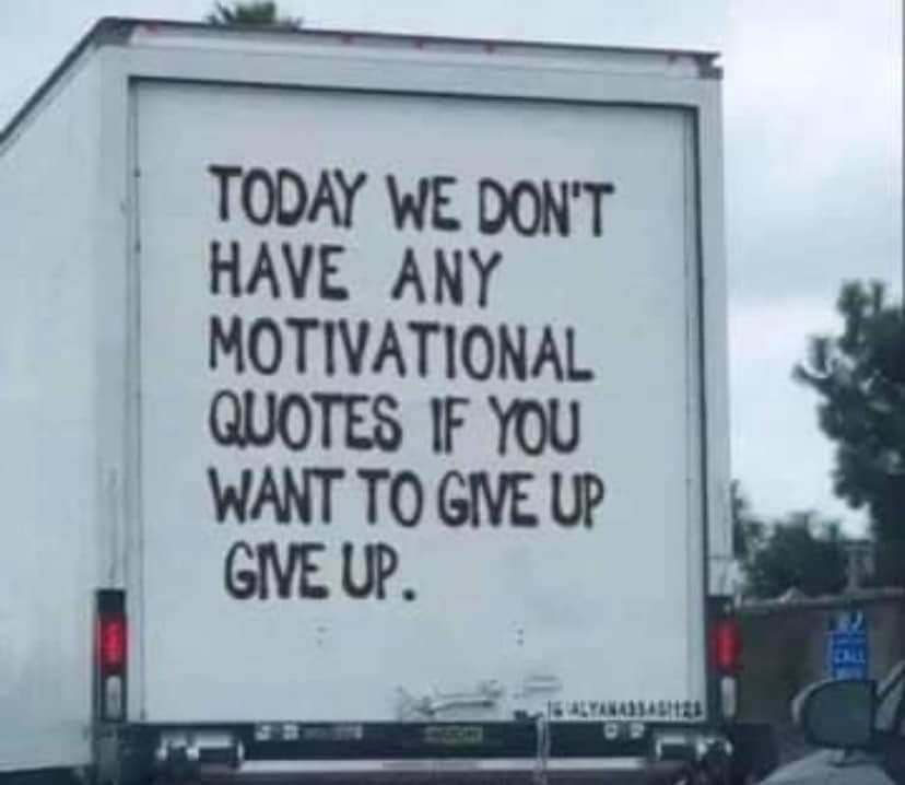 The back of a white delivery truck has black handwritten text that reads 'TODAY WE DON'T HAVE ANY MOTIVATIONAL QUOTES IF YOU…