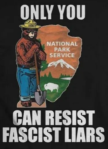 A black t-shirt graphic features a vintage National Park Service bear ranger holding a shovel, standing beside a stylized…