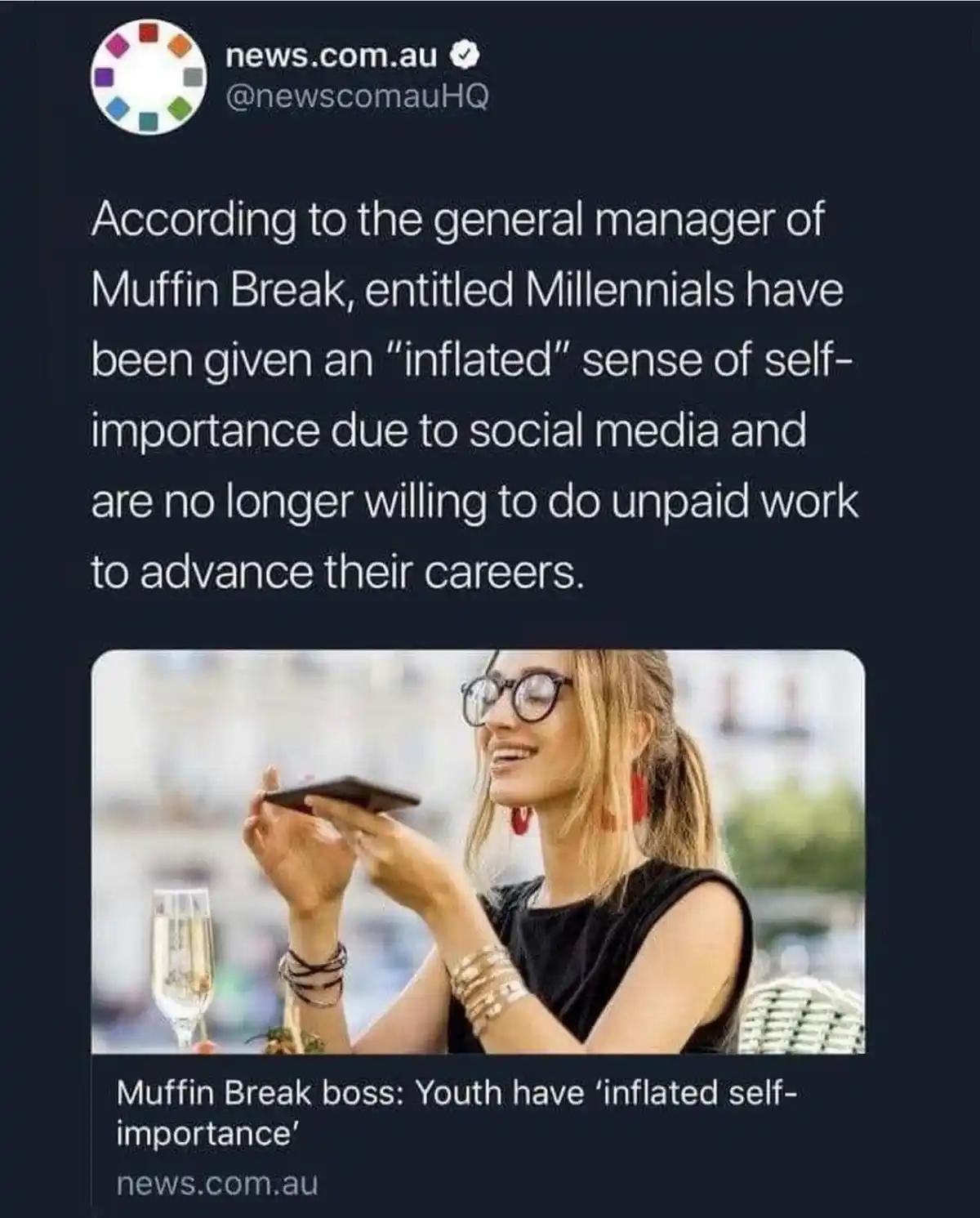 A screenshot of a news.com.au tweet featuring a photo of a smiling woman with glasses, holding a smartphone while seated at…
