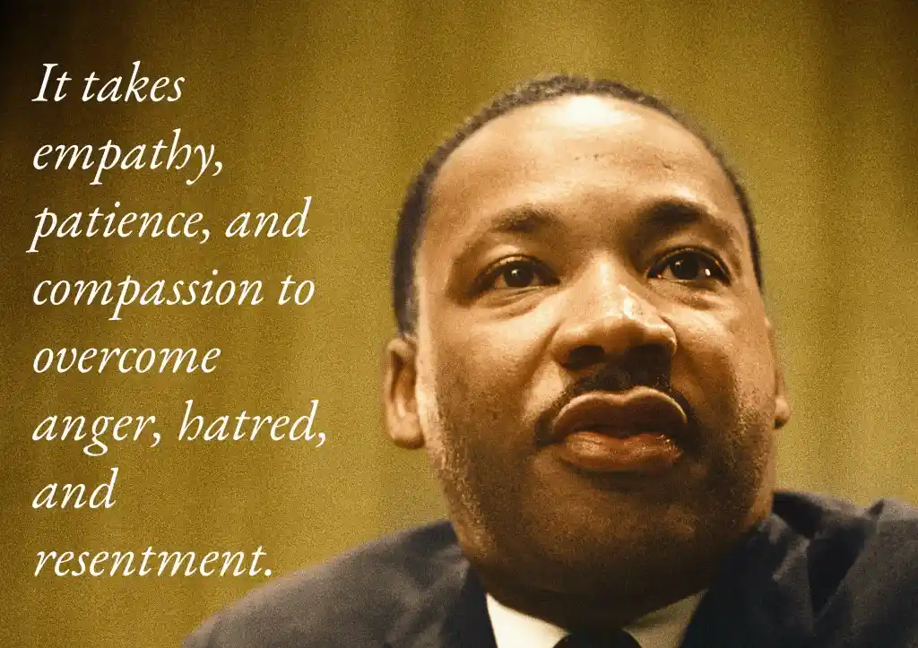A sepia-toned close-up photo of Martin Luther King Jr. looking upward with a thoughtful expression. White cursive text is…