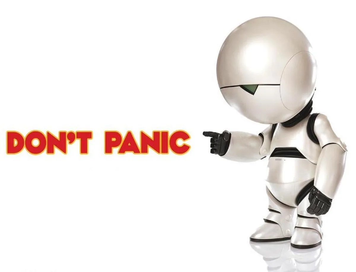 A small, silver, stylized robot with a single green eye slit points its right index finger toward bold red text that reads…