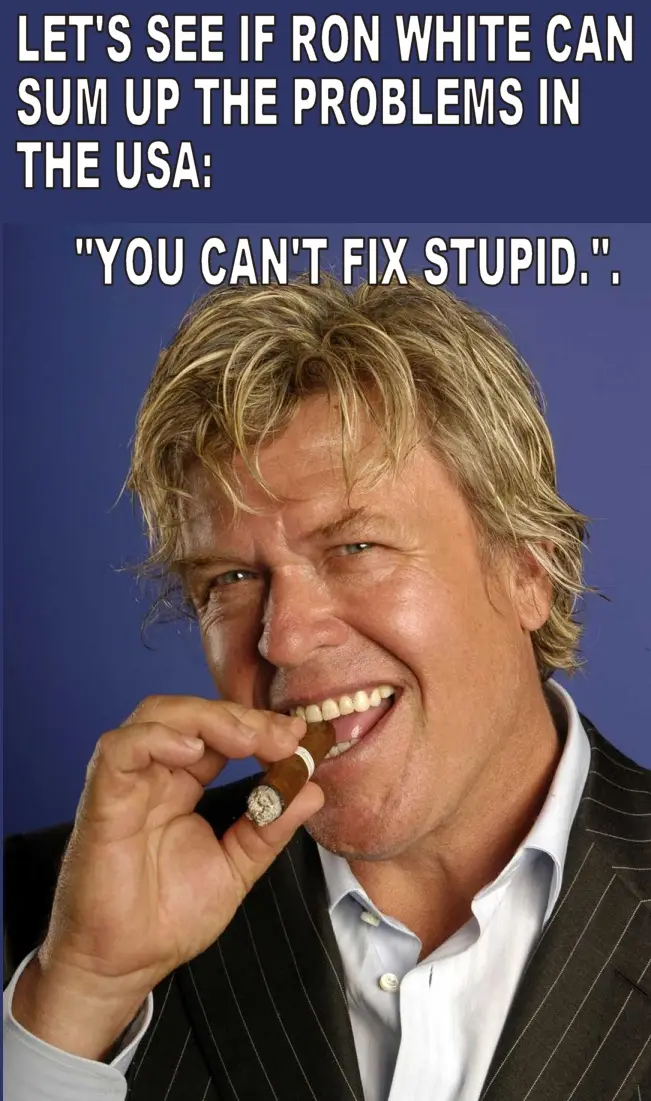 A man with blond hair, wearing a pinstripe suit and holding a cigar in his mouth, smiles against a blue background. Overlaid…