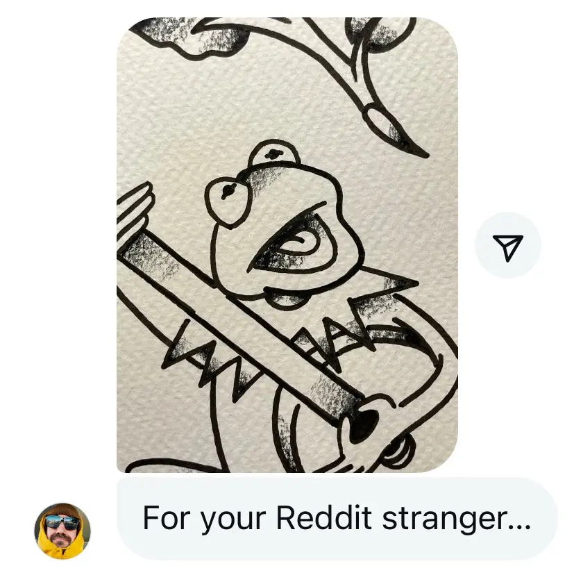 A hand-drawn black-and-white sketch shows a cartoon frog-like creature with a wide, toothy grin, holding a long, spiked…
