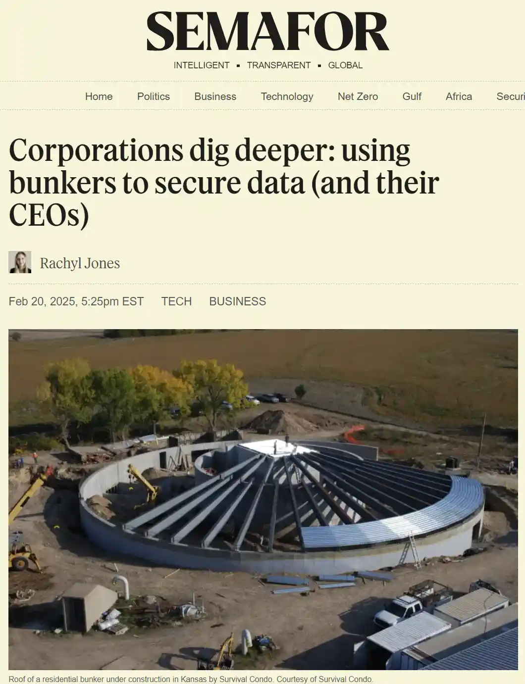 An aerial photo shows a large, circular, partially constructed underground bunker in a rural field, with construction…