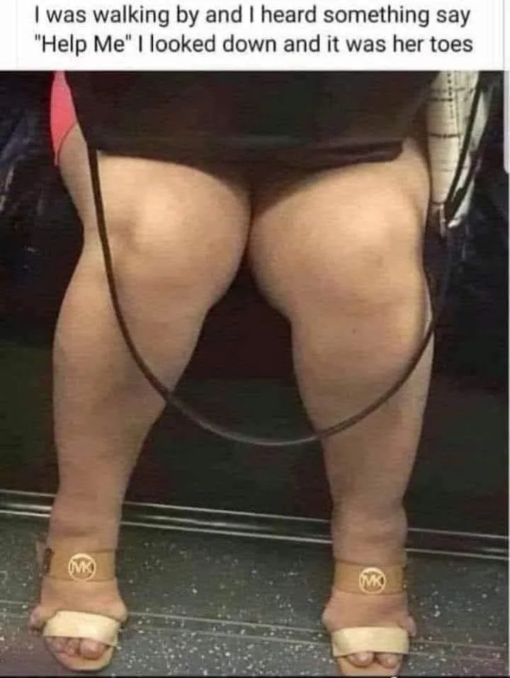 A person is seated, wearing beige Michael Kors sandals with thick straps, their legs and thighs visible. The sandals are…