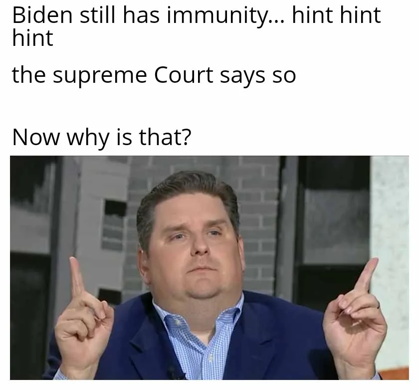 A man in a blue suit and checkered shirt raises both index fingers while looking upward with a confused or questioning…