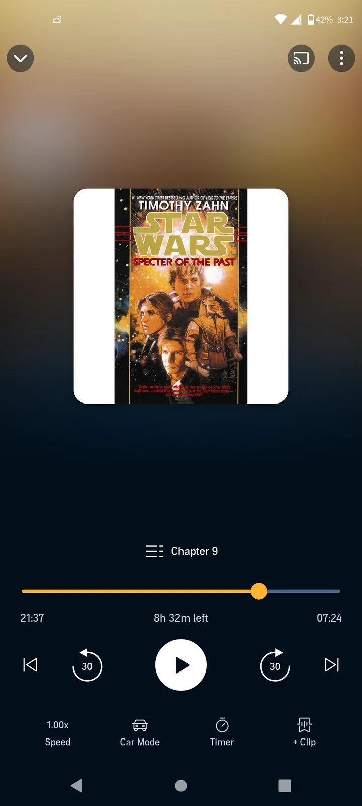 A smartphone screen shows an audiobook player with the cover of 'Star Wars: Specter of the Past' by Timothy Zahn. The player…
