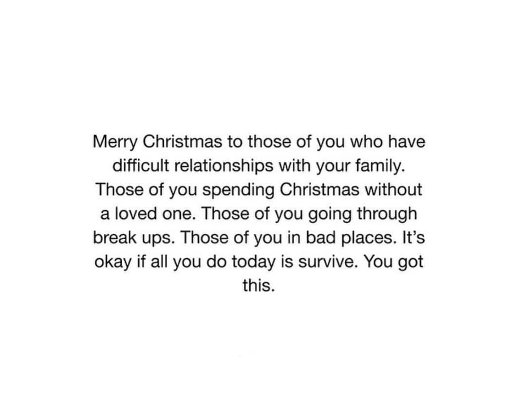 A plain white background with centered black text that reads a compassionate Christmas message acknowledging people facing…