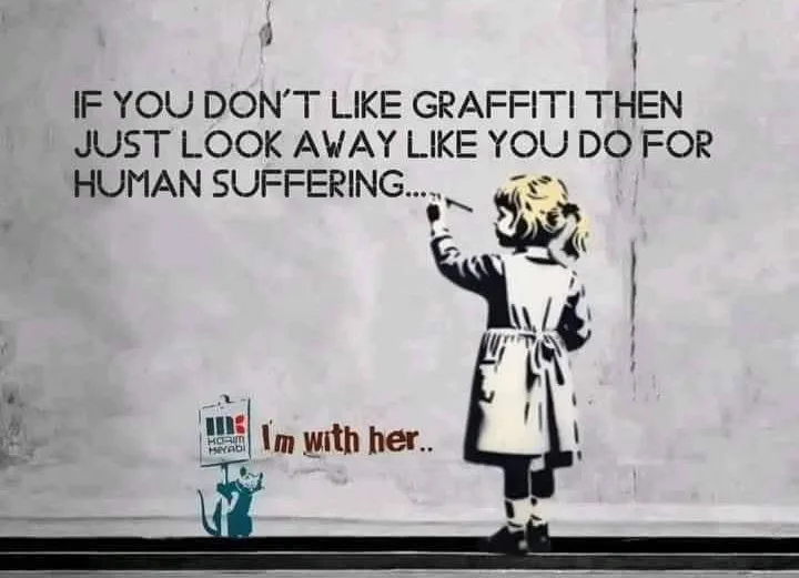 A stencil-style image shows a young girl in a coat painting graffiti on a wall, while a small cat holding a sign that reads…