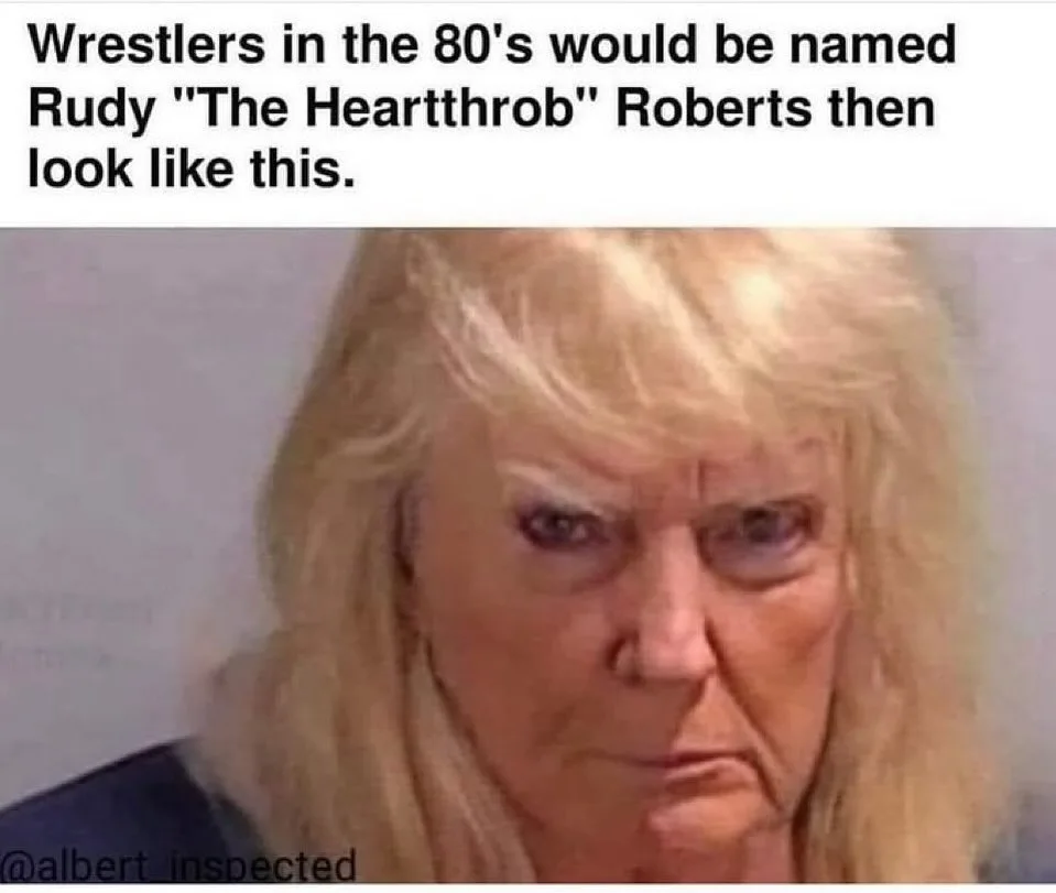 The image shows a close-up of an older woman with blonde hair and a stern, unimpressed facial expression, looking directly…