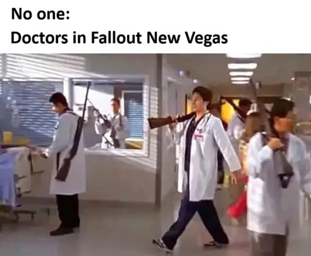 A still from a TV show or movie shows several people in white lab coats walking through a hospital hallway, each carrying a…