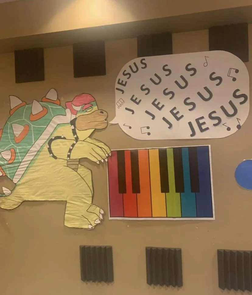 A handmade wall decoration features a yellow turtle-like character with a green shell and red hat, resembling Bowser from…