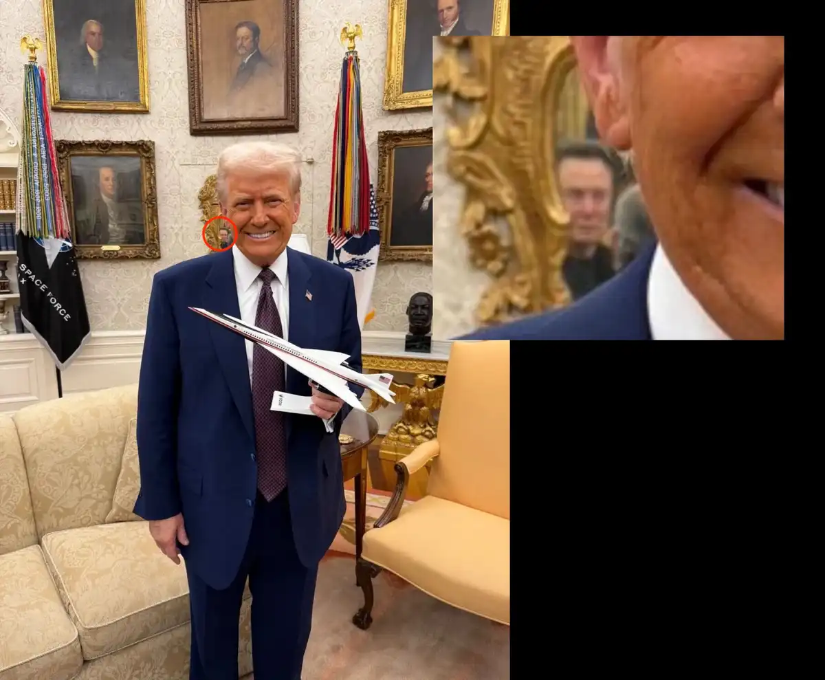 A man in a suit holds a model airplane in an ornate room with portraits on the wall. A red circle highlights a small, blurry…