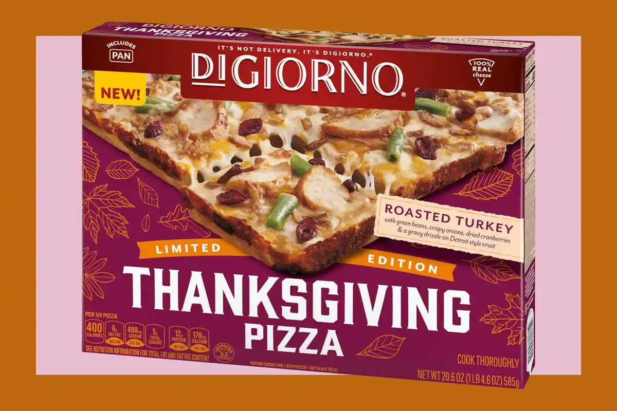 A box of DiGiorno Thanksgiving pizza, featuring roasted turkey, green beans, cranberries, and gravy on a Detroit-style…