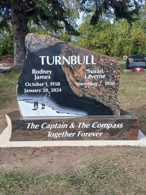 A large, polished granite gravestone for the Turnbull family, listing Rodney James (born October 1, 1950, died January 20…