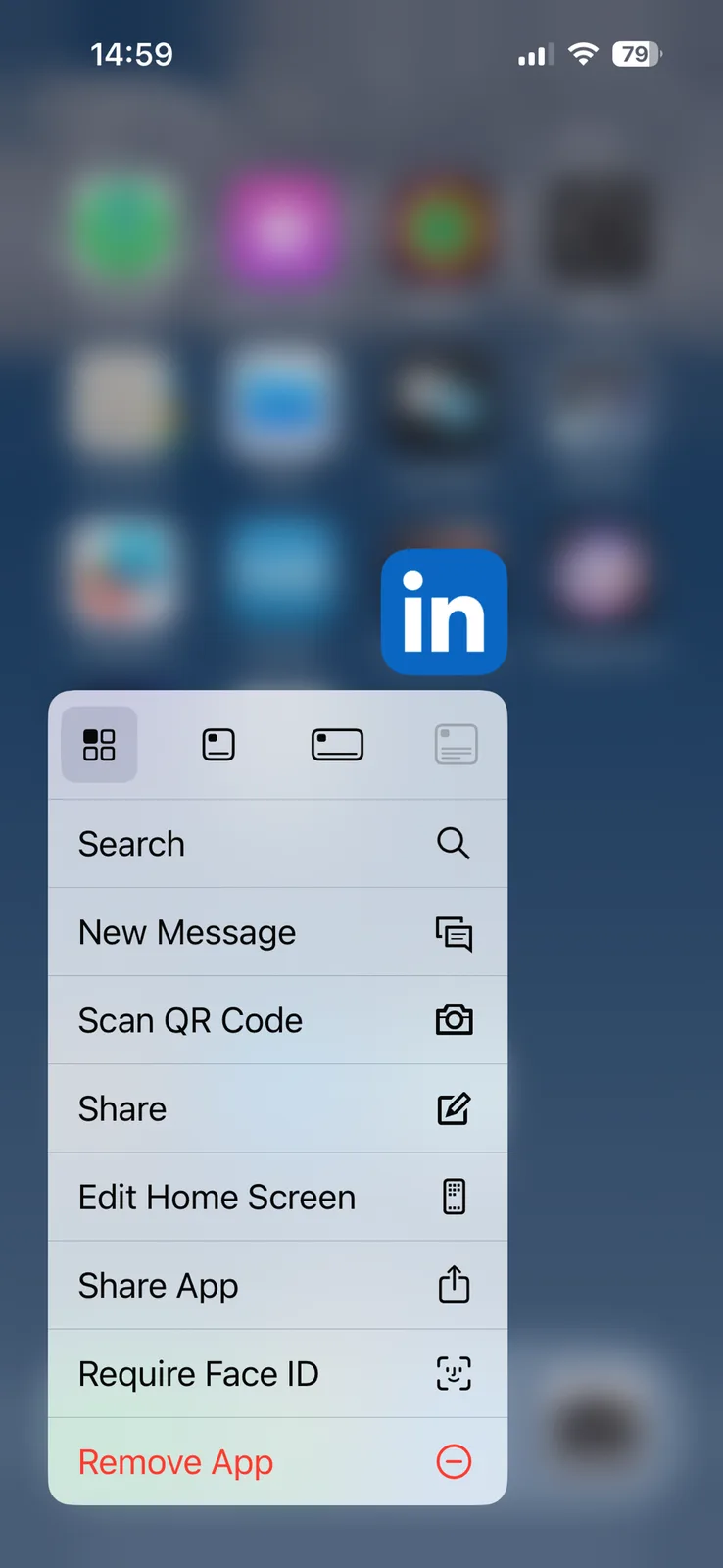 An iPhone home screen context menu is open over a blurred background of app icons, with the LinkedIn app icon floating above…
