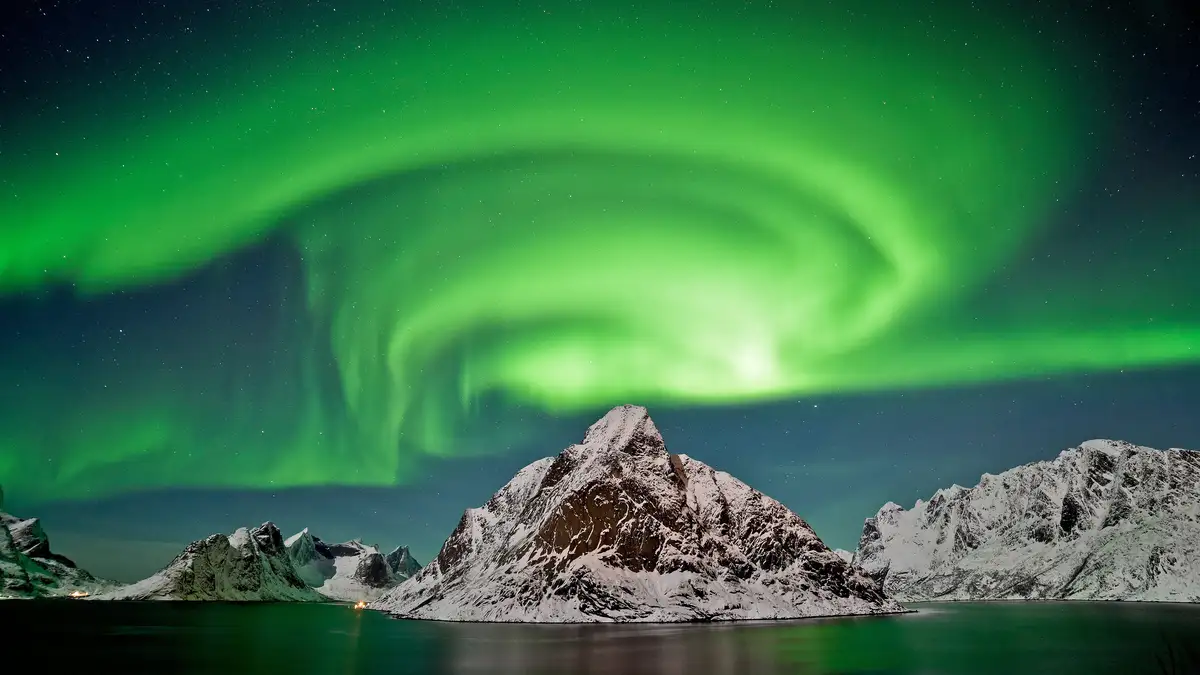 A swirling masterpiece captures the aurora borealis above Norway's Lofoten Islands, mirroring the powerful maelstrom, known…