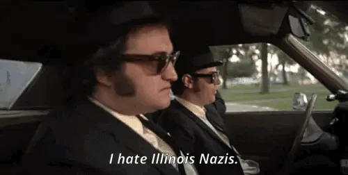 A six-panel meme strip from the movie 'The Blues Brothers' showing Jake (John Belushi) in the passenger seat of a car…