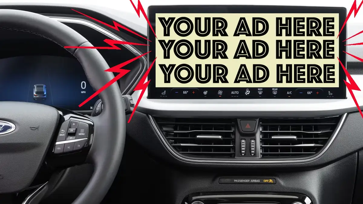 The image shows the interior of a Ford car, focusing on the steering wheel and central touchscreen display. The screen is…