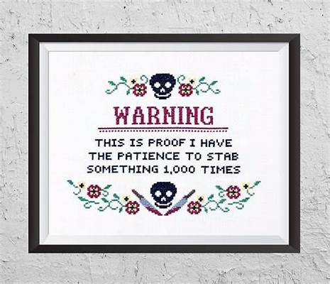 A framed cross-stitch artwork displays a warning message in red and black thread, flanked by skull motifs and floral…