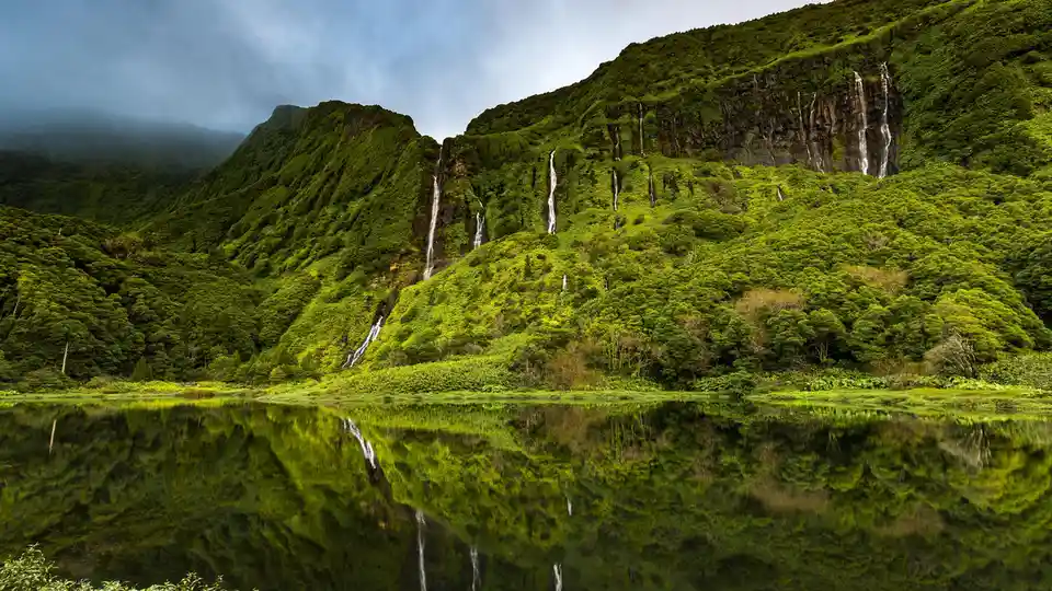 On Flores Island, Ribeira do Ferreiro boasts unspoiled perfection, featuring dozens of waterfalls cascading down lush-green…
