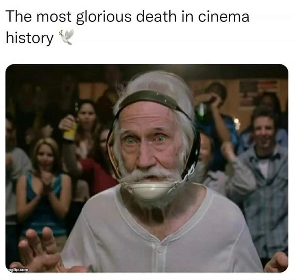 An elderly man with white hair and a mustache wears a white plastic mouthpiece and a headset, looking shocked with wide…