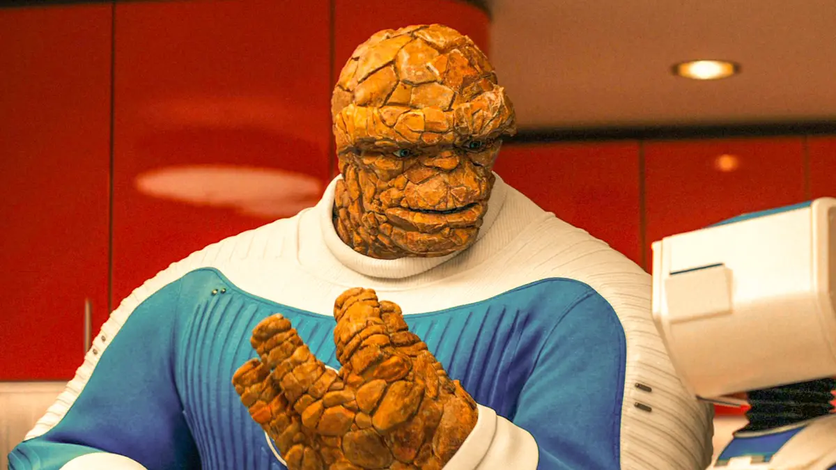 The image shows the character The Thing from the Fantastic Four, recognizable by his orange, rocky, textured skin and…