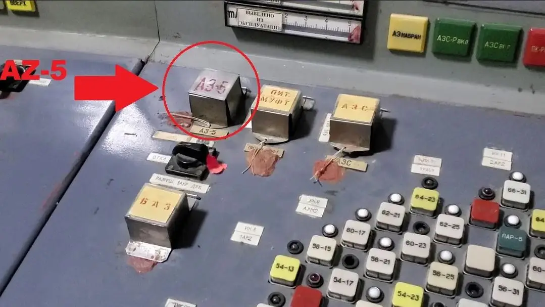 A close-up of a Soviet-era control panel with Cyrillic labels and switches, where a red arrow points to a metal switch…