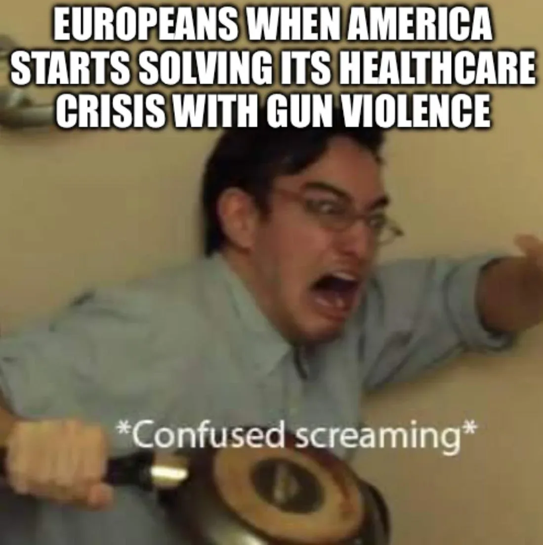 A man with glasses, wearing a light-colored shirt, is captured mid-scream with an expression of shock and confusion, holding…