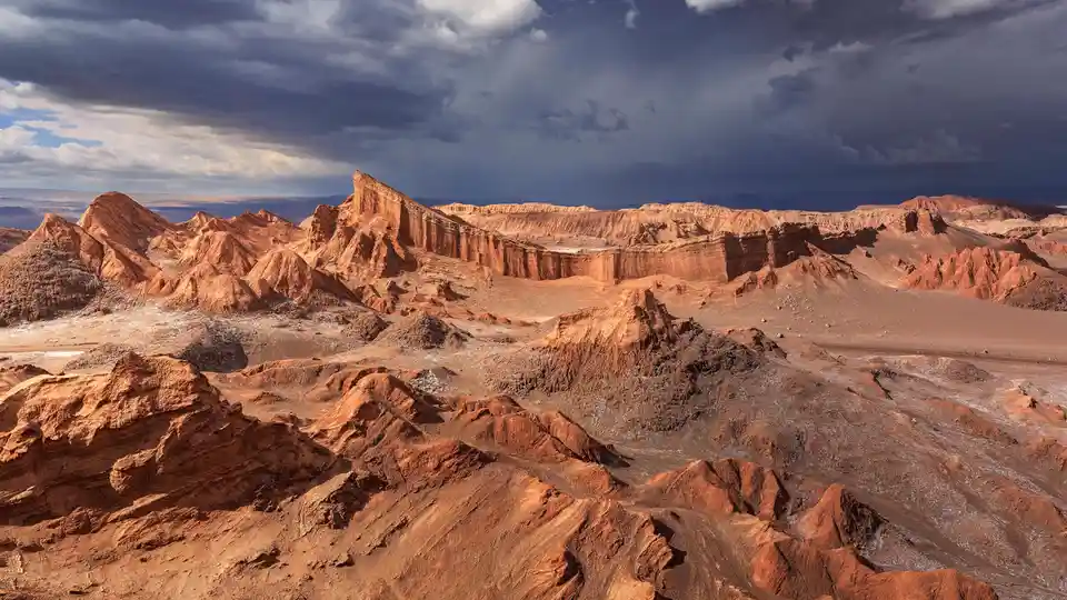 In the Atacama Desert's Valley of the Moon, a stunning rock formation resembles a stadium. This unique landscape, in Chile's…