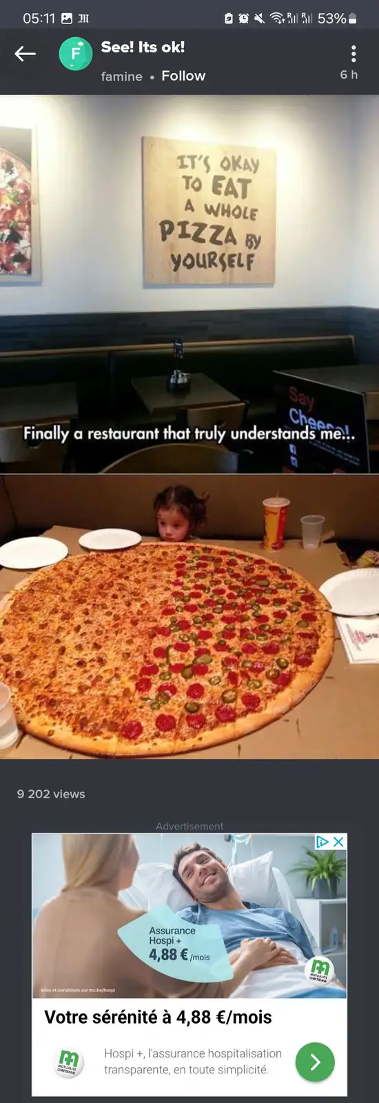 The image shows a restaurant interior with a wooden sign on the wall that reads 'IT'S OKAY TO EAT A WHOLE PIZZA BY…