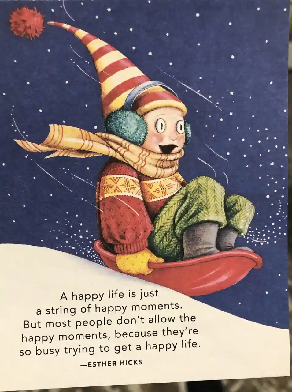 An illustrated child in winter gear, including a striped hat with a red pom-pom, earmuffs, scarf, and sweater, is sledding…