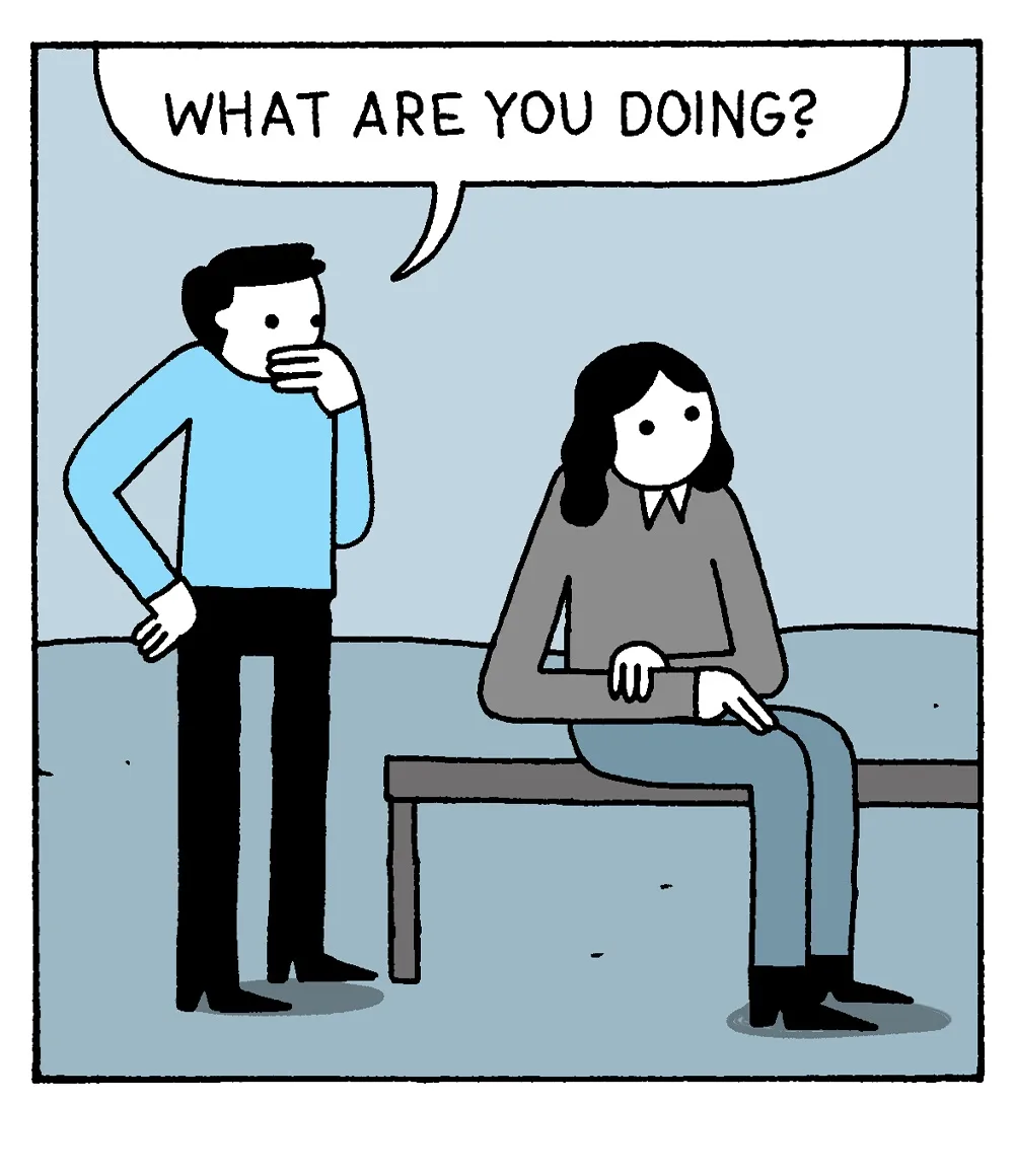 A cartoon depicts a man in a blue shirt standing and asking a woman sitting on a bench, "WHAT ARE YOU DOING?" The woman…