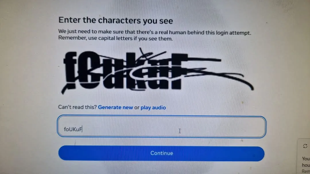 A CAPTCHA login screen shows distorted text 'foUkuf' that has been scribbled over with a black marker. Below, a text input…