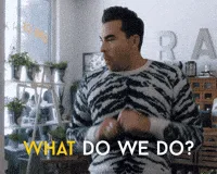 A man in a black-and-white zebra-striped sweater repeatedly asks the question 'WHAT DO WE DO?' with increasing frustration…