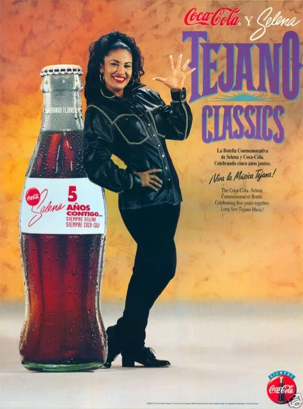 A vintage Coca-Cola advertisement featuring Selena Quintanilla posing next to a giant commemorative bottle celebrating five…