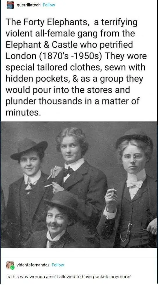 A vintage black-and-white photo shows four women dressed in early 20th-century tailored suits and hats, some holding…