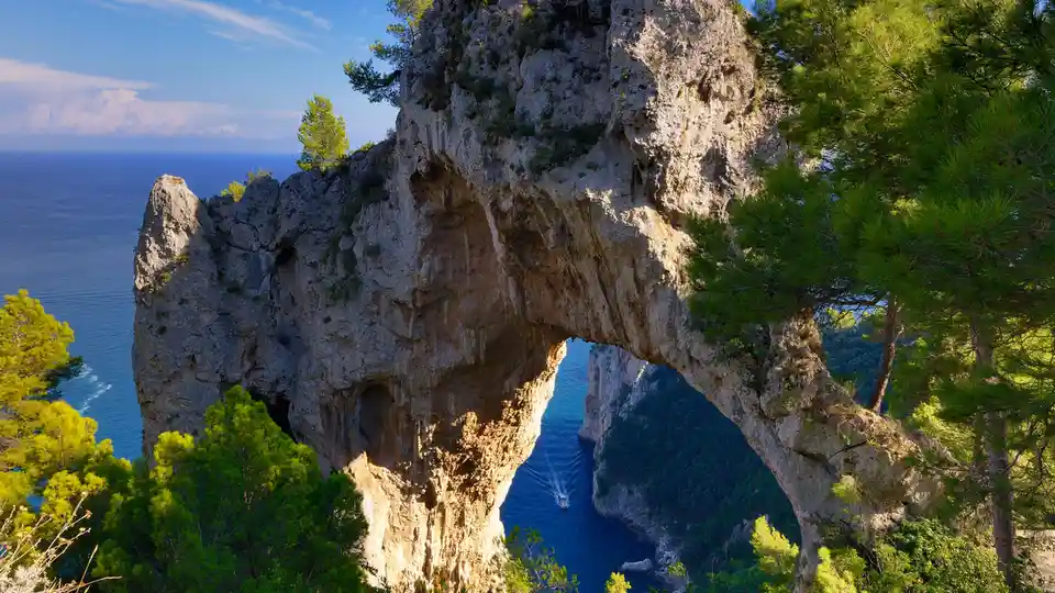 On the Italian island of Capri, a striking stone arch, the Arco Naturale, overlooks the Tyrrhenian Sea. This collapsed…