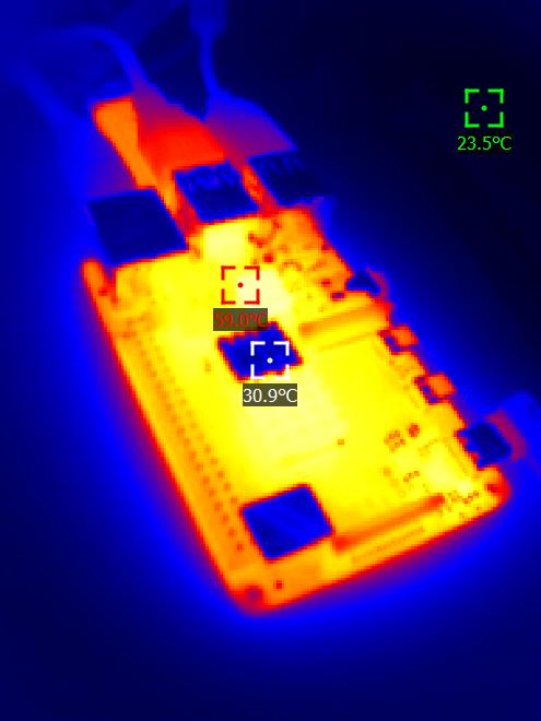 A thermal imaging photo of an electronic circuit board, with color gradients showing heat distribution. Three temperature…