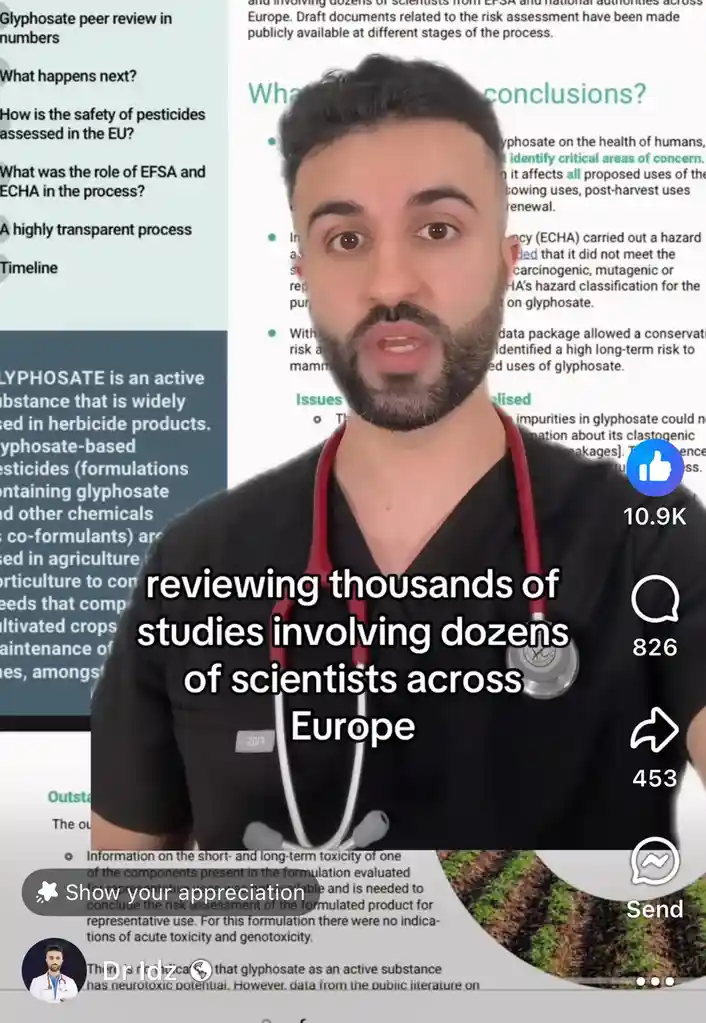 A man in black scrubs with a red stethoscope around his neck is shown in a video frame, looking directly at the camera with…
