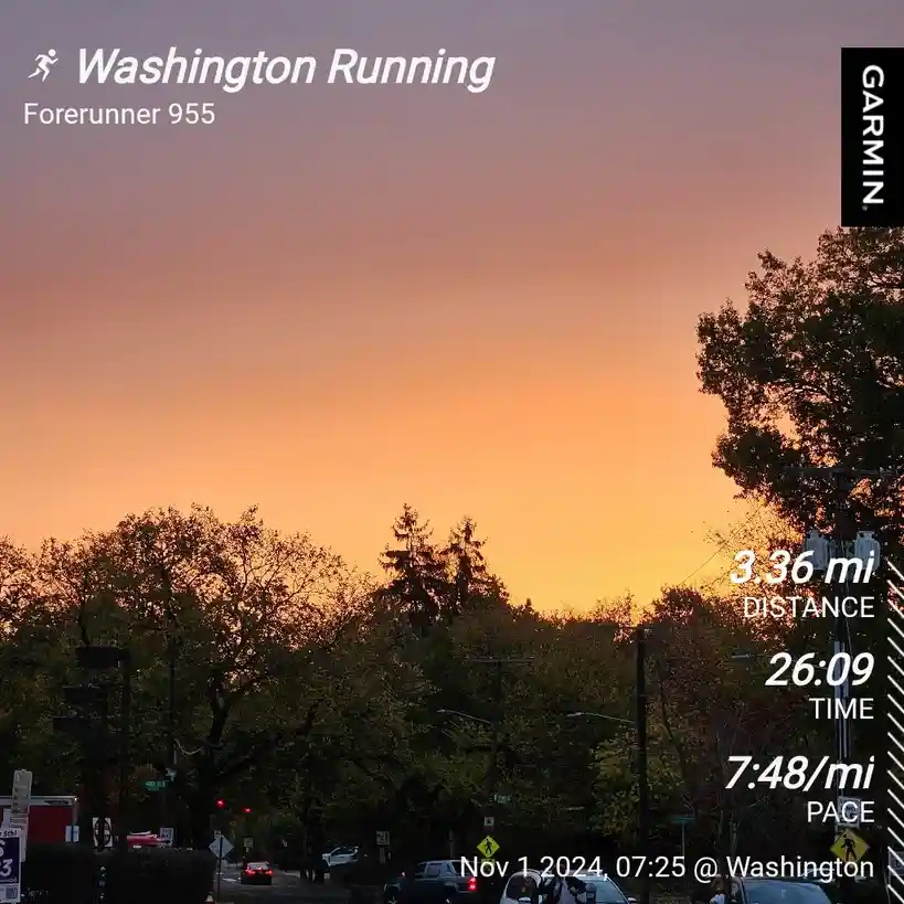 A screenshot from a Garmin Forerunner 955 running watch displays a sunset over a street with trees, showing a 3.36-mile run…