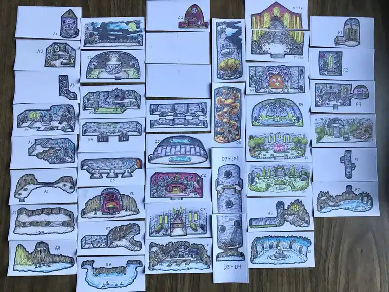 A collection of hand-drawn, colorful, and whimsical dungeon and landscape maps laid out on a wooden surface, each labeled…