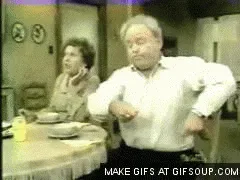 A six-frame sequence from a vintage TV show shows an older man at a dining table dramatically raising his arms and twisting…